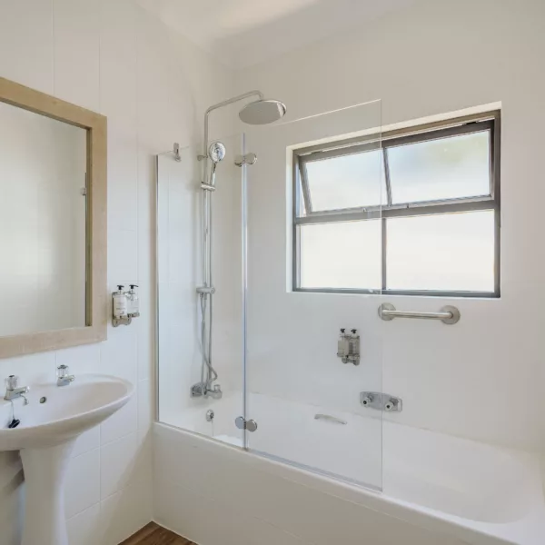 bright hotel bathroom, with bath and basin